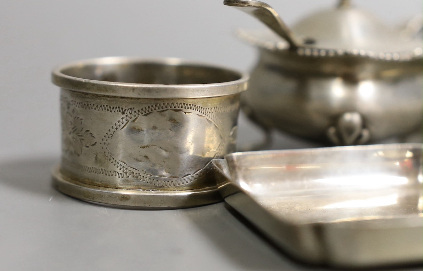 A George V silver mounted cigarette box, 11.5cm and other small sundry silver and plated items including napkin rings, condiments and small dish.